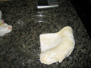 Put dough in pan and unfold